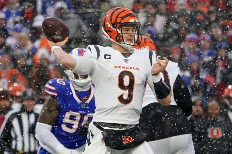 Jan 22, 2023; Orchard Park, New York, USA; Cincinnati Bengals quarterback Joe Burrow (9) passes the ball against the Buffalo Bills during the second quarter of an AFC divisional round game at Highmark Stadium. Mandatory Credit: Gregory Fisher-USA TODAY Sports