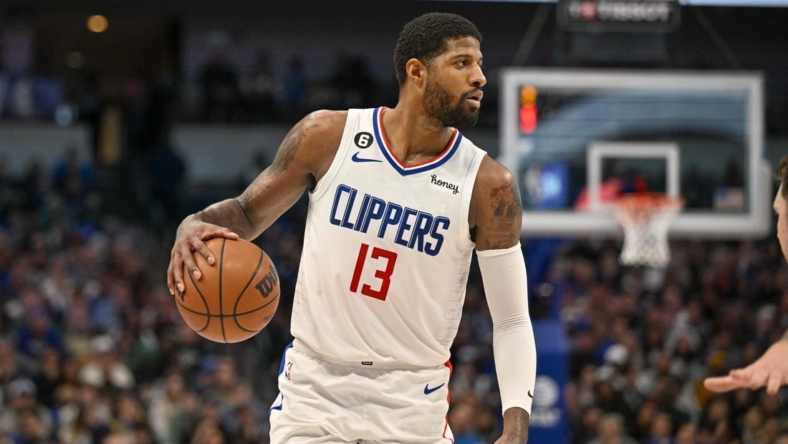 Jan 22, 2023; Dallas, Texas, USA; LA Clippers guard Paul George (13) brings the ball up court against the Dallas Mavericks during the second half at the American Airlines Center. Mandatory Credit: Jerome Miron-USA TODAY Sports