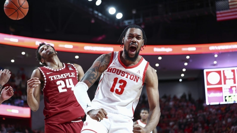 Jan 22, 2023; Houston, Texas, USA; Houston Cougars forward J'Wan Roberts (13) reacts after a play during the second half against the Temple Owls at Fertitta Center. Mandatory Credit: Troy Taormina-USA TODAY Sports