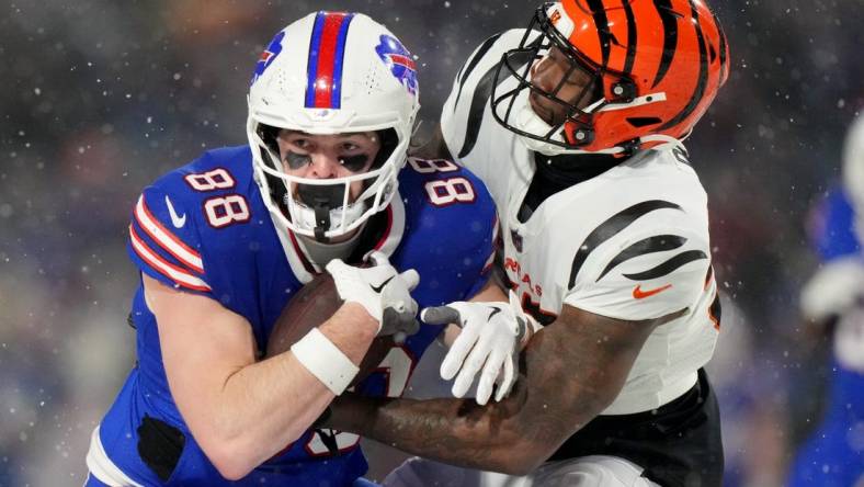 Cincinnati Bengals linebacker Germaine Pratt (57) tackles Buffalo Bills tight end Dawson Knox (88) in the fourth quarter during an NFL divisional playoff football game between the Cincinnati Bengals and the Buffalo Bills, Sunday, Jan. 22, 2023, at Highmark Stadium in Orchard Park, N.Y.

Cincinnati Bengals At Buffalo Bills Afc Divisional Jan 22 1397