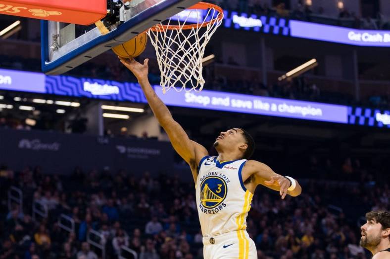 Jan 22, 2023; San Francisco, California, USA; Golden State Warriors guard Jordan Poole (3) lays up the ball against the Brooklyn Nets  during the first half at Chase Center. Mandatory Credit: John Hefti-USA TODAY Sports