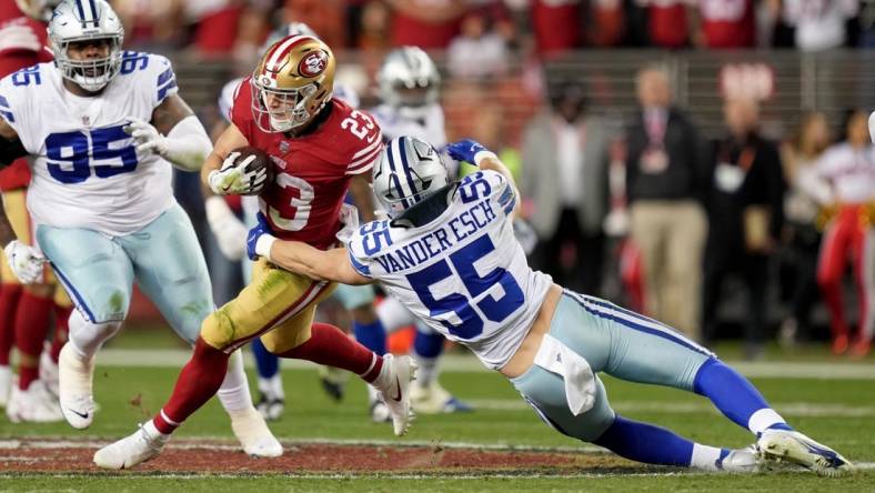 Jan 22, 2023; Santa Clara, California, USA; San Francisco 49ers running back Christian McCaffrey (23) runs past Dallas Cowboys linebacker Leighton Vander Esch (55) during the third quarter of a NFC divisional round game at Levi's Stadium. Mandatory Credit: Kyle Terada-USA TODAY Sports