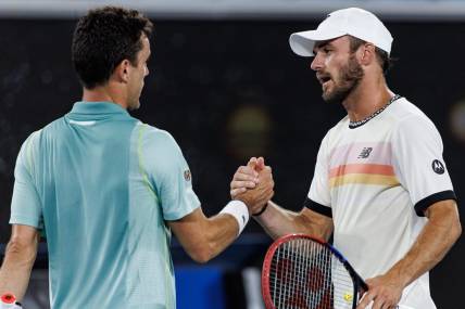 Jan 23, 2023; Melbourne, Victoria, Australia; Tommy Paul of the United States shakes hands with Roberto Bautista-Agut of Spain after beating him on day eight of the 2023 Australian Open tennis tournament at Melbourne Park. Mandatory Credit: Mike Frey-USA TODAY Sports