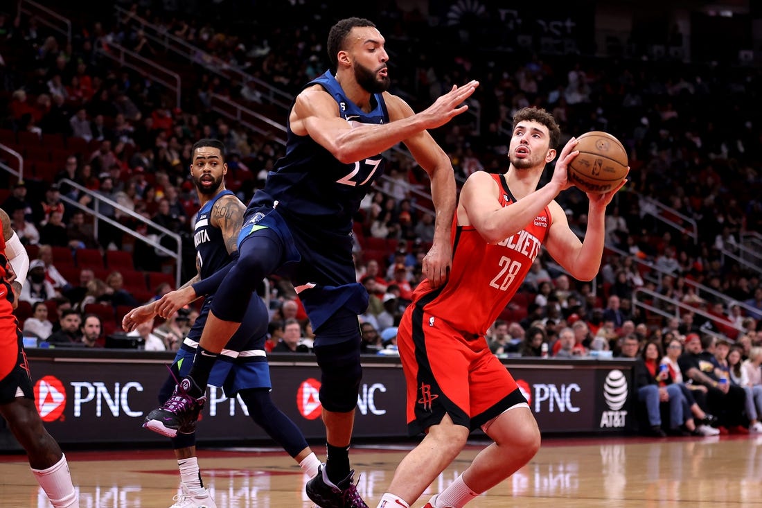 Jan 23, 2023; Houston, Texas, USA; Houston Rockets center Alperen Sengun (28) takes an inside shot while Minnesota Timberwolves center Rudy Gobert (27) defends during the second quarter at Toyota Center. Mandatory Credit: Erik Williams-USA TODAY Sports