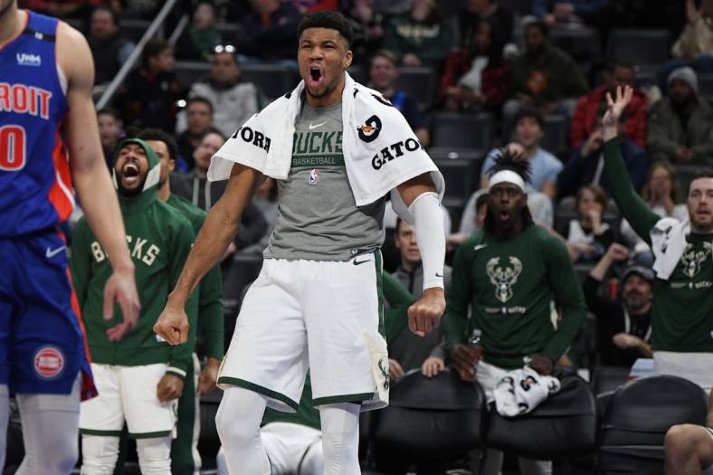 Jan 23, 2023; Detroit, Michigan, USA; Milwaukee Bucks forward Giannis Antetokounmpo's (34) reacts from the bench after his brother Thanasis (not pictured) made a basket against the Detroit Pistons in the fourth quarter at Little Caesars Arena. Mandatory Credit: Lon Horwedel-USA TODAY Sports