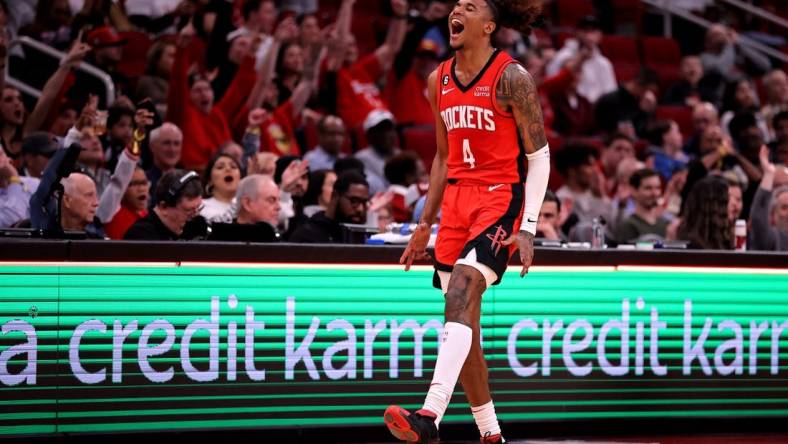 Jan 23, 2023; Houston, Texas, USA; Houston Rockets guard Jalen Green (4) reacts after making a three-point shot against the Minnesota Timberwolves during the third quarter at Toyota Center. Mandatory Credit: Erik Williams-USA TODAY Sports