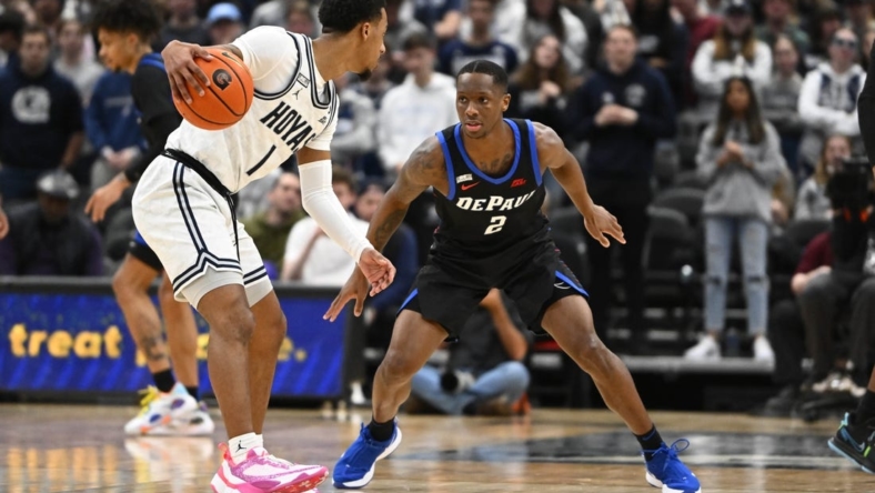 Jan 24, 2023; Washington, District of Columbia, USA; Georgetown Hoyas guard Primo Spears (1) dribbles as DePaul Blue Demons guard Umoja Gibson (2) defends during the first half at Capital One Arena. Mandatory Credit: Brad Mills-USA TODAY Sports