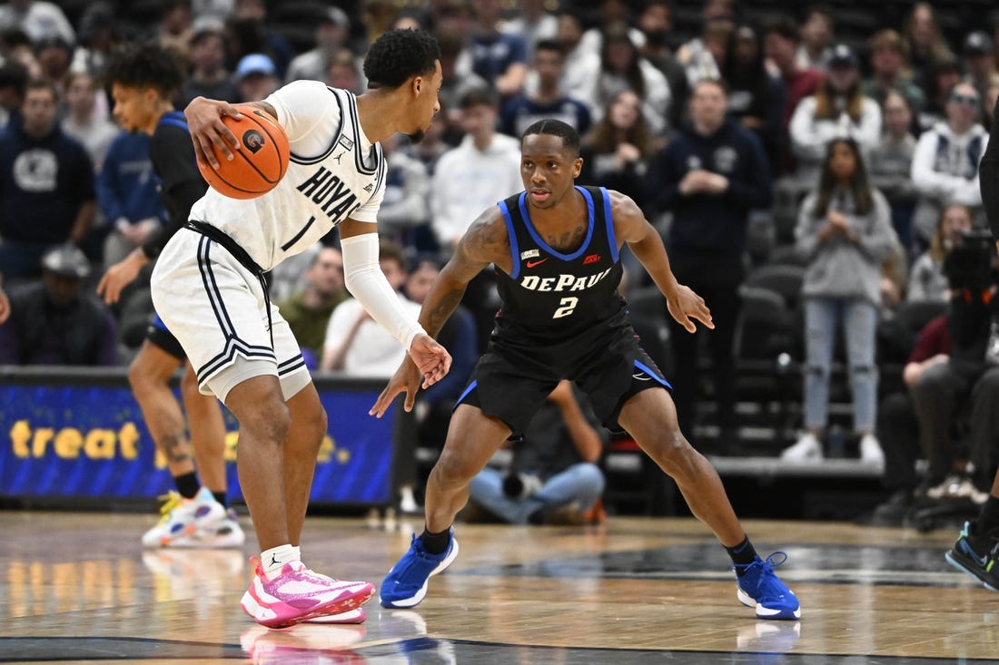 Jan 24, 2023; Washington, District of Columbia, USA; Georgetown Hoyas guard Primo Spears (1) dribbles as DePaul Blue Demons guard Umoja Gibson (2) defends during the first half at Capital One Arena. Mandatory Credit: Brad Mills-USA TODAY Sports