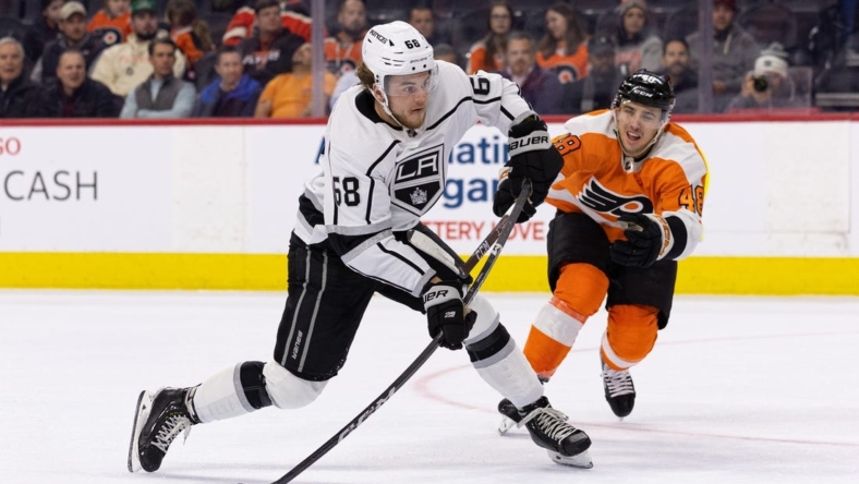 Jan 24, 2023; Philadelphia, Pennsylvania, USA; Los Angeles Kings left wing Samuel Fagemo (68) shoots for a score in front of Philadelphia Flyers center Morgan Frost (48) during the second period at Wells Fargo Center. Mandatory Credit: Bill Streicher-USA TODAY Sports