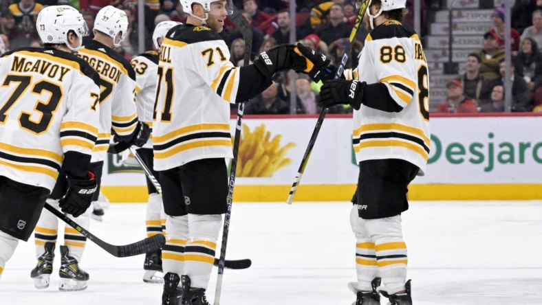Jan 24, 2023; Montreal, Quebec, CAN; Boston Bruins forward Taylor Hall (71) celebrates with teammate forward David Pastrnak (88) after scoring a goal against the Montreal Canadiens during the second period at the Bell Centre. Mandatory Credit: Eric Bolte-USA TODAY Sport