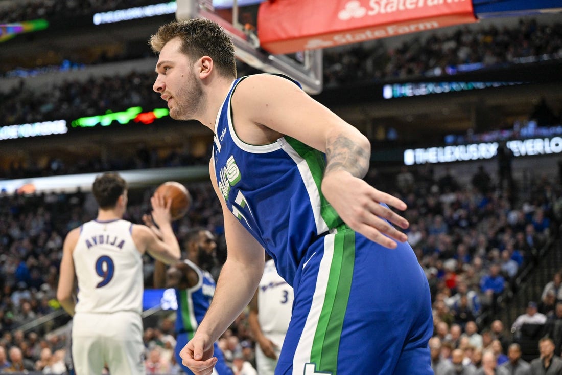 Jan 24, 2023; Dallas, Texas, USA; Dallas Mavericks guard Luka Doncic (77) runs back up the court after scoring against the Washington Wizards during the second quarter at the American Airlines Center. Mandatory Credit: Jerome Miron-USA TODAY Sports