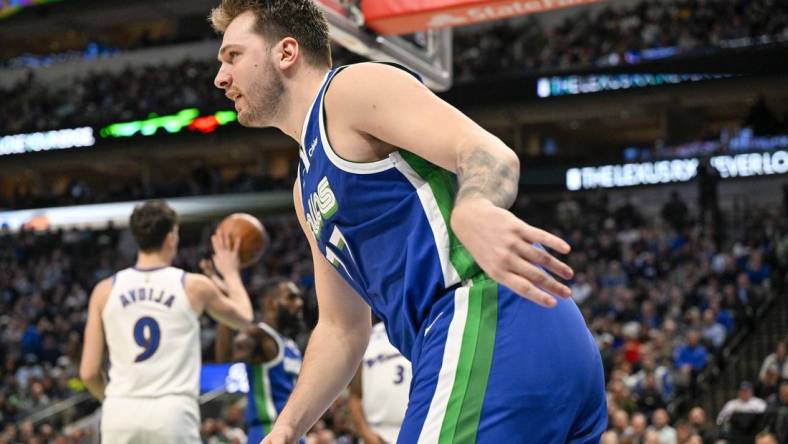 Jan 24, 2023; Dallas, Texas, USA; Dallas Mavericks guard Luka Doncic (77) runs back up the court after scoring against the Washington Wizards during the second quarter at the American Airlines Center. Mandatory Credit: Jerome Miron-USA TODAY Sports