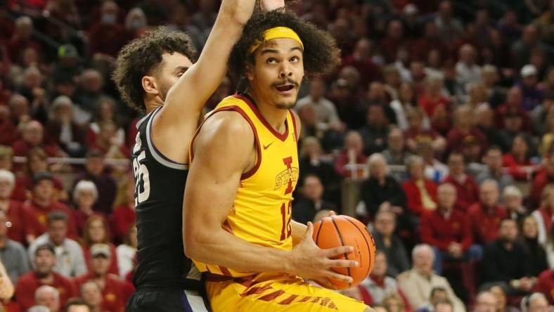 Iowa State University Cyclones forward Robert Jones (12)  looks for a shot around Kansas State Wildcats forward Ismael Massoud (25) during the first half at Hilton Coliseum Tuesday, 2023, in Ames, Iowa.

Kansas State And Iowa State Men S Basketball