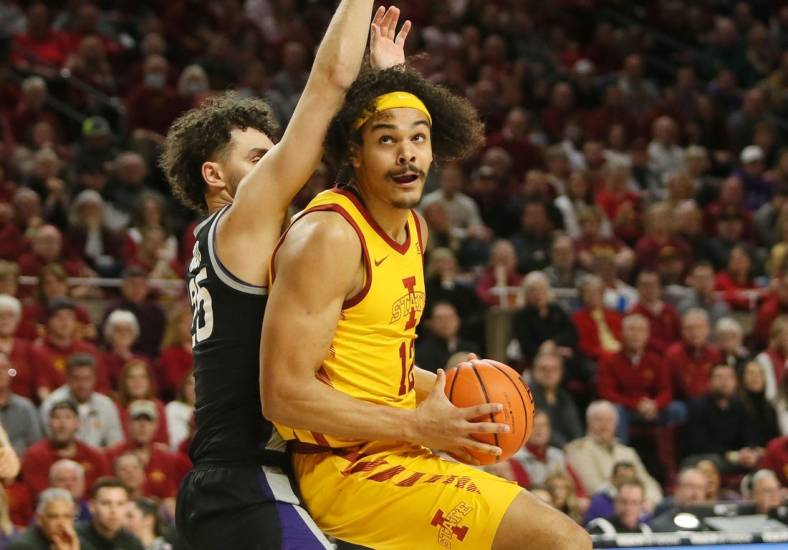 Iowa State University Cyclones forward Robert Jones (12)  looks for a shot around Kansas State Wildcats forward Ismael Massoud (25) during the first half at Hilton Coliseum Tuesday, 2023, in Ames, Iowa.

Kansas State And Iowa State Men S Basketball