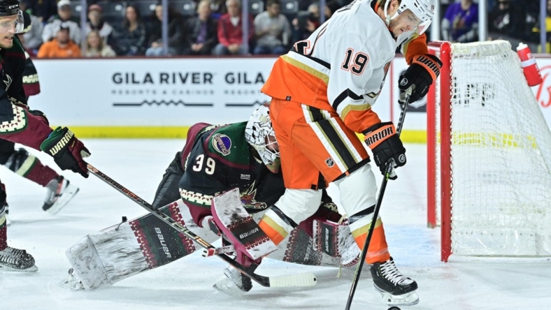 Jan 24, 2023; Tempe, Arizona, USA; Anaheim Ducks right wing Troy Terry (19) carries the puck as Arizona Coyotes goaltender Connor Ingram (39) defends in the first period at Mullett Arena. Mandatory Credit: Matt Kartozian-USA TODAY Sports