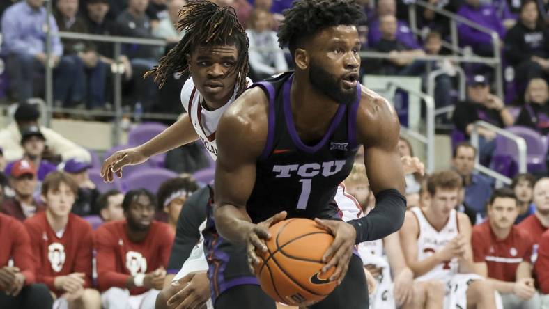 Jan 24, 2023; Fort Worth, Texas, USA;  TCU Horned Frogs guard Mike Miles Jr. (1) grabs the ball in front of Oklahoma Sooners guard Otega Oweh (3) during the second half at Ed and Rae Schollmaier Arena. Mandatory Credit: Kevin Jairaj-USA TODAY Sports