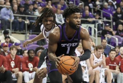 Jan 24, 2023; Fort Worth, Texas, USA;  TCU Horned Frogs guard Mike Miles Jr. (1) grabs the ball in front of Oklahoma Sooners guard Otega Oweh (3) during the second half at Ed and Rae Schollmaier Arena. Mandatory Credit: Kevin Jairaj-USA TODAY Sports