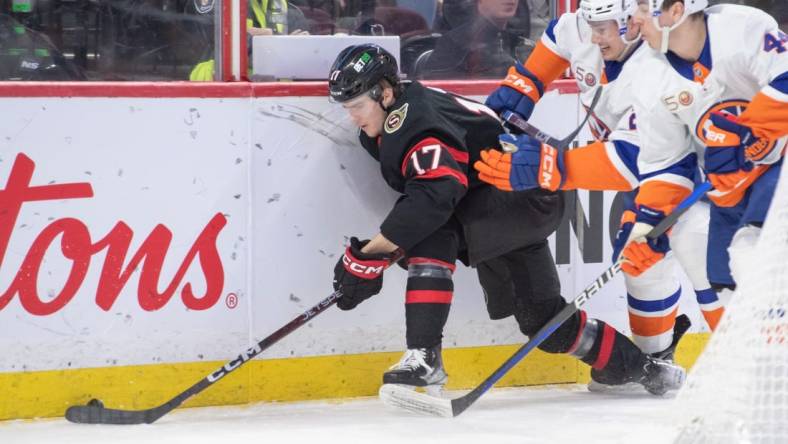 Jan 25, 2023; Ottawa, Ontario, CAN; Ottawa Senators center Ridly Greig (17) controls the puck in the first period against the New York Islanders at the Canadian Tire Centre. Mandatory Credit: Marc DesRosiers-USA TODAY Sports