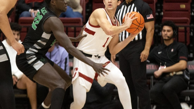Jan 25, 2023; Stanford, California, USA; Chicago State Cougars forward Arol Kacuol (22) defends Stanford Cardinal guard Isa Silva (1) during the first half at Maples Pavilion. Mandatory Credit: D. Ross Cameron-USA TODAY Sports