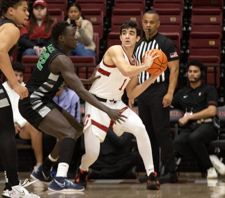 Jan 25, 2023; Stanford, California, USA; Chicago State Cougars forward Arol Kacuol (22) defends Stanford Cardinal guard Isa Silva (1) during the first half at Maples Pavilion. Mandatory Credit: D. Ross Cameron-USA TODAY Sports