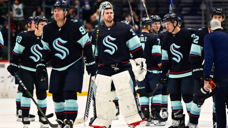 Jan 25, 2023; Seattle, Washington, USA; Seattle Kraken players celebrate after defeating the Vancouver Canucks at Climate Pledge Arena. Seattle defeated Vancouver 6-1. Mandatory Credit: Steven Bisig-USA TODAY Sports
