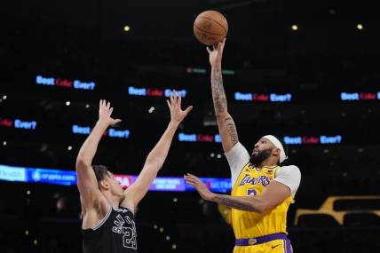 Jan 25, 2023; Los Angeles, California, USA; Los Angeles Lakers forward Anthony Davis (3) shoots the ball over San Antonio Spurs forward Zach Collins (23) in the second half at Crypto.com Arena. Mandatory Credit: Kirby Lee-USA TODAY Sports