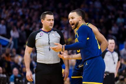 Jan 25, 2023; San Francisco, California, USA;  Golden State Warriors guard Stephen Curry (30) argues with official Matt Boland after being ejected for throwing his mouth guard during the second half against the Memphis Grizzlies at Chase Center. Mandatory Credit: John Hefti-USA TODAY Sports