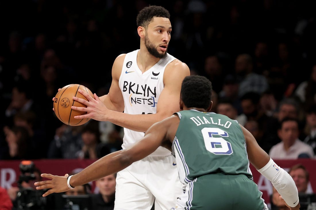 Jan 26, 2023; Brooklyn, New York, USA; Brooklyn Nets guard Ben Simmons (10) controls the ball against Detroit Pistons guard Hamidou Diallo (6) during the second quarter at Barclays Center. Mandatory Credit: Brad Penner-USA TODAY Sports