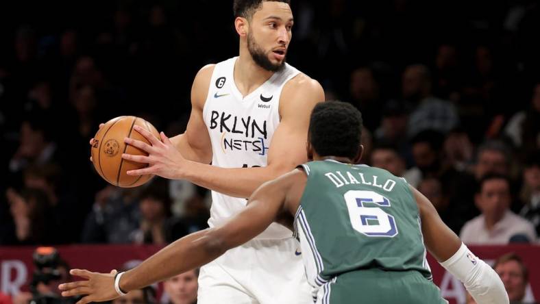 Jan 26, 2023; Brooklyn, New York, USA; Brooklyn Nets guard Ben Simmons (10) controls the ball against Detroit Pistons guard Hamidou Diallo (6) during the second quarter at Barclays Center. Mandatory Credit: Brad Penner-USA TODAY Sports