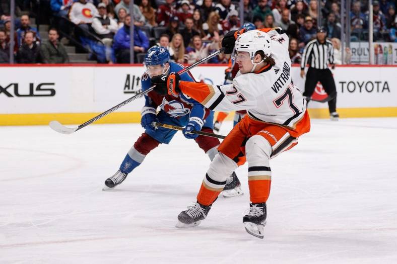 Jan 26, 2023; Denver, Colorado, USA; Anaheim Ducks right wing Frank Vatrano (77) scores on a shot ahead of Colorado Avalanche left wing Artturi Lehkonen (62) in the first period at Ball Arena. Mandatory Credit: Isaiah J. Downing-USA TODAY Sports