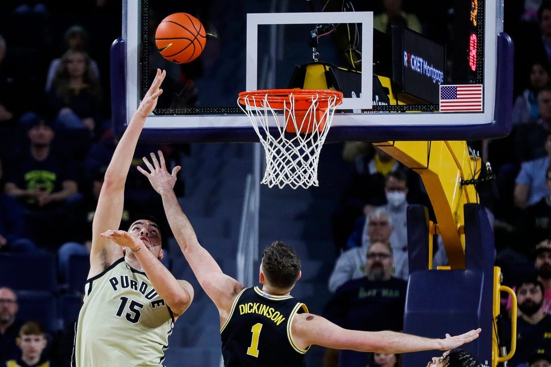 Purdue center Zach Edey (15) goes to the basket against Michigan center Hunter Dickinson (1) during the first half at Crisler Center in Ann Arbor on Thursday, Jan. 26, 2023.