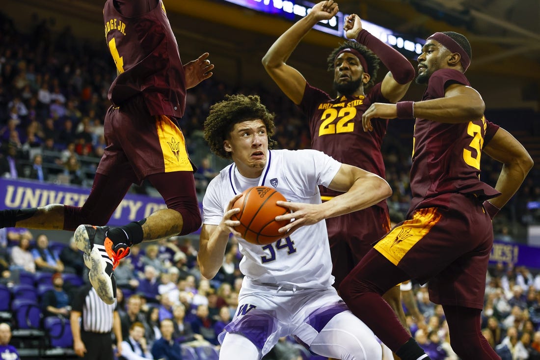 Jan 26, 2023; Seattle, Washington, USA; Washington Huskies center Braxton Meah (34) pump fakes against Arizona State Sun Devils guard Desmond Cambridge Jr. (4), forward Warren Washington (22) and guard Devan Cambridge (35) during the first half at Alaska Airlines Arena at Hec Edmundson Pavilion. Mandatory Credit: Joe Nicholson-USA TODAY Sports