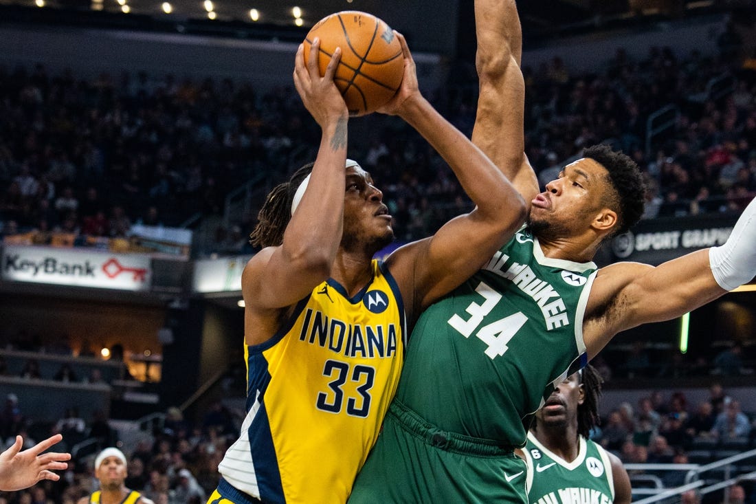 Jan 27, 2023; Indianapolis, Indiana, USA; Indiana Pacers center Myles Turner (33) shoots the ball while Milwaukee Bucks forward Giannis Antetokounmpo (34) defends in the first quarter at Gainbridge Fieldhouse. Mandatory Credit: Trevor Ruszkowski-USA TODAY Sports