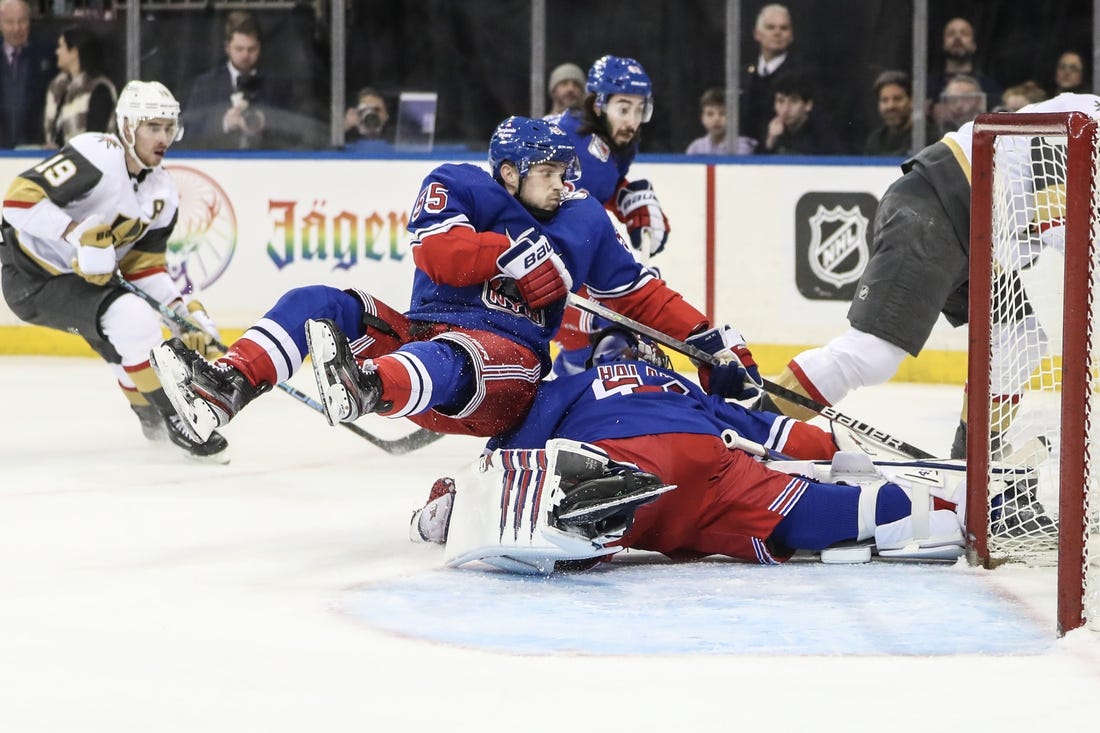 Jan 27, 2023; New York, New York, USA;  New York Rangers defenseman Ryan Lindgren (55) collides with goaltender Jaroslav Halak (41) attempting to stop a shot on goal in the first period  against the Vegas Golden Knights at Madison Square Garden. Mandatory Credit: Wendell Cruz-USA TODAY Sports