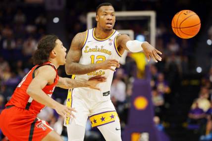 Jan 28, 2023; Baton Rouge, Louisiana, USA; LSU Tigers forward KJ Williams (12) passes the ball against the Texas Tech Red Raiders during the first half at Pete Maravich Assembly Center. Mandatory Credit: Andrew Wevers-USA TODAY Sports