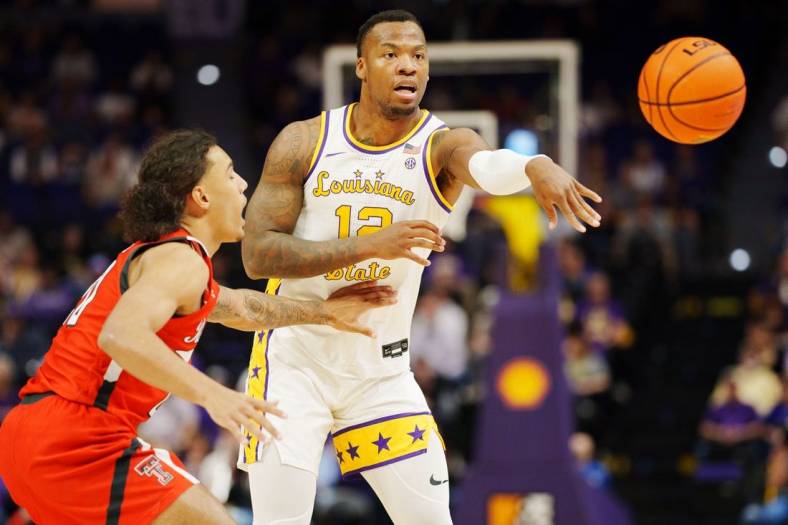 Jan 28, 2023; Baton Rouge, Louisiana, USA; LSU Tigers forward KJ Williams (12) passes the ball against the Texas Tech Red Raiders during the first half at Pete Maravich Assembly Center. Mandatory Credit: Andrew Wevers-USA TODAY Sports