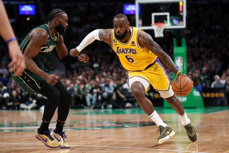Jan 28, 2023; Boston, Massachusetts, USA; Los Angeles Lakers forward LeBron James (6) drives to the basket defended by Boston Celtics forward Jaylen Brown (7) during the second half at TD Garden. Mandatory Credit: Paul Rutherford-USA TODAY Sports