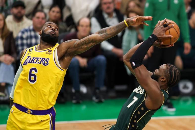 Jan 28, 2023; Boston, Massachusetts, USA; Boston Celtics forward Jaylen Brown (7) shoots defended by Los Angeles Lakers forward LeBron James (6) during the second half at TD Garden. Mandatory Credit: Paul Rutherford-USA TODAY Sports