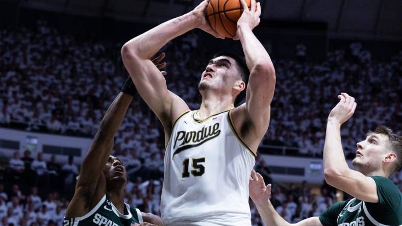 Jan 29, 2023; West Lafayette, Indiana, USA; Purdue Boilermakers center Zach Edey (15) shoots the ball while Michigan State Spartans guard Tyson Walker (2) and center Carson Cooper (15) defend in the second half at Mackey Arena. Mandatory Credit: Trevor Ruszkowski-USA TODAY Sports