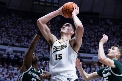 Jan 29, 2023; West Lafayette, Indiana, USA; Purdue Boilermakers center Zach Edey (15) shoots the ball while Michigan State Spartans guard Tyson Walker (2) and center Carson Cooper (15) defend in the second half at Mackey Arena. Mandatory Credit: Trevor Ruszkowski-USA TODAY Sports
