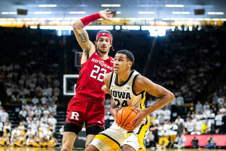 Iowa forward Kris Murray, right, drives to the basket as Rutgers guard Caleb McConnell defends during a NCAA Big Ten Conference men's basketball game, Sunday, Jan. 29, 2023, at Carver-Hawkeye Arena in Iowa City, Iowa.

230129 Rutgers Iowa Mbb 051 Jpg
