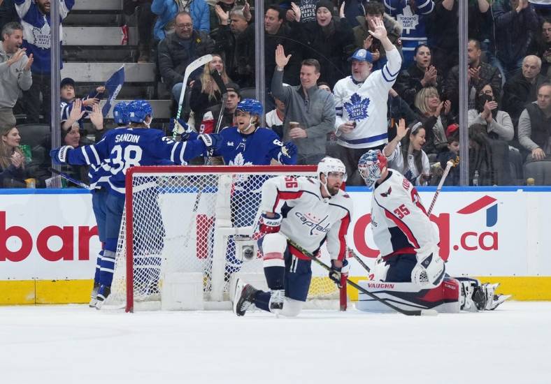 Jan 29, 2023; Toronto, Ontario, CAN; Toronto Maple Leafs right wing William Nylander (88) scores a goal and celebrates with Toronto Maple Leafs defenseman Rasmus Sandin (38) against the Washington Capitals during the second period at Scotiabank Arena. Mandatory Credit: Nick Turchiaro-USA TODAY Sports