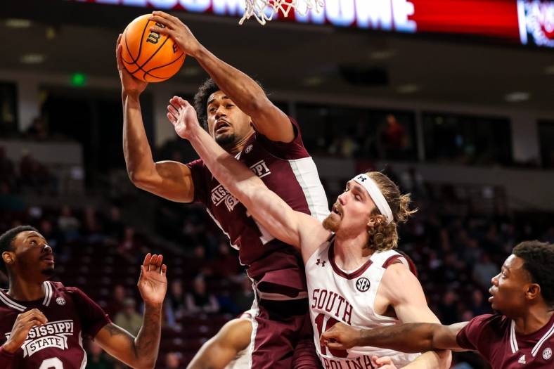 Jan 31, 2023; Columbia, South Carolina, USA; Mississippi State Bulldogs forward Tolu Smith (1) grabs a rebound over South Carolina Gamecocks forward Hayden Brown (10) in the first half at Colonial Life Arena. Mandatory Credit: Jeff Blake-USA TODAY Sports