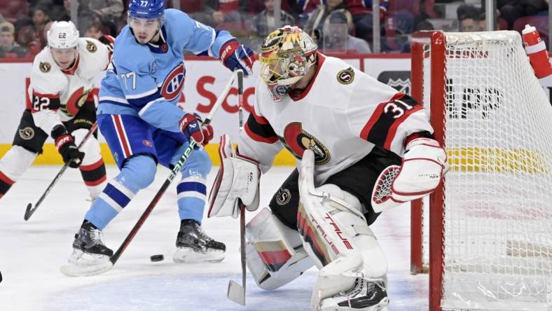 Jan 31, 2023; Montreal, Quebec, CAN; Ottawa Senators goaltender Anton Forsberg (31) stops Montreal Canadiens forward Kirby Dach (77) during the first period at the Bell Centre. Mandatory Credit: Eric Bolte-USA TODAY Sports