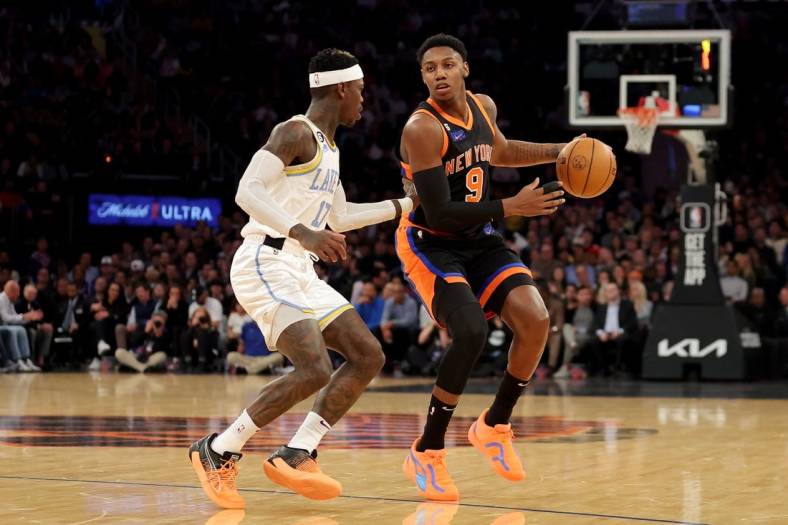 Jan 31, 2023; New York, New York, USA; New York Knicks guard RJ Barrett (9) brings the ball up court against Los Angeles Lakers guard Dennis Schroder (17) during the first quarter at Madison Square Garden. Mandatory Credit: Brad Penner-USA TODAY Sports