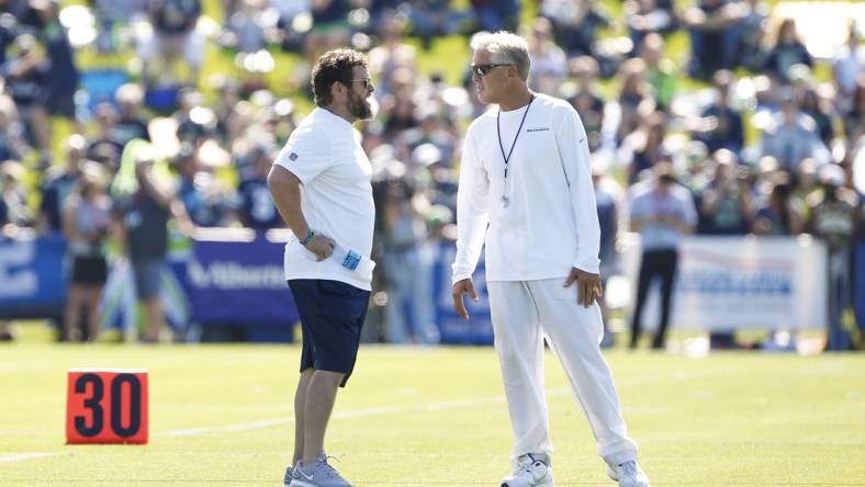 Jul 25, 2019; Renton, WA, USA; Seattle Seahawks head coach Pete Carroll, right, talks with general manager John Schneider during training camp practice at the Virginia Mason Athletic Center. Mandatory Credit: Joe Nicholson-USA TODAY Sports