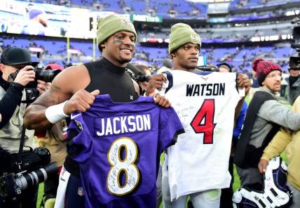 Nov 17, 2019; Baltimore, MD, USA; Baltimore Ravens quarterback Lamar Jackson (right) exchanges jerseys with Houston Texans quarterback Deshaun Watson (left) after the game at M&T Bank Stadium. Mandatory Credit: Evan Habeeb-USA TODAY Sports