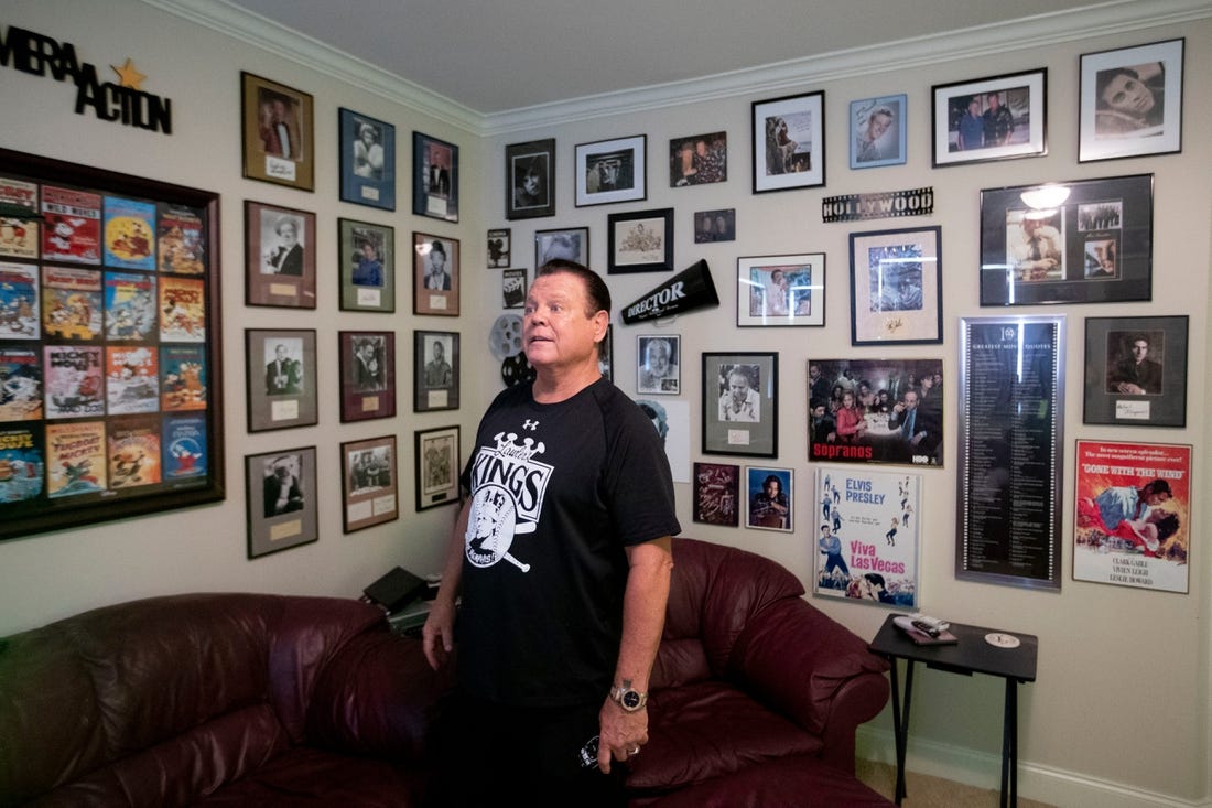 Jerry Lawler looks around at the autographed photographs in his home theater room Wednesday, Sept. 16, 2020, at his home in Memphis.

091620 Jerrylawler 19 Msg