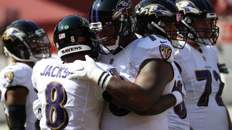 Oct 4, 2020; Landover, Maryland, USA; Baltimore Ravens quarterback Lamar Jackson (8) hugs Ravens offensive tackle Orlando Brown (78) during warmups prior to the Ravens'game against the Washington Football Team at FedExField. Mandatory Credit: Geoff Burke-USA TODAY Sports