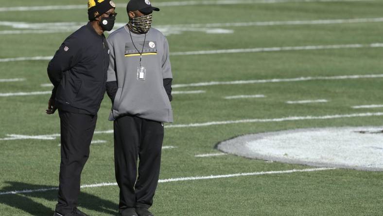 Dec 27, 2020; Pittsburgh, Pennsylvania, USA;  Pittsburgh Steelers assistant head coach John Mitchell (left) and head coach Mike Tomlin (right) look on before the Steelers hit the Indianapolis Colts at Heinz Field. Pittsburgh won 28-24. Mandatory Credit: Charles LeClaire-USA TODAY Sports